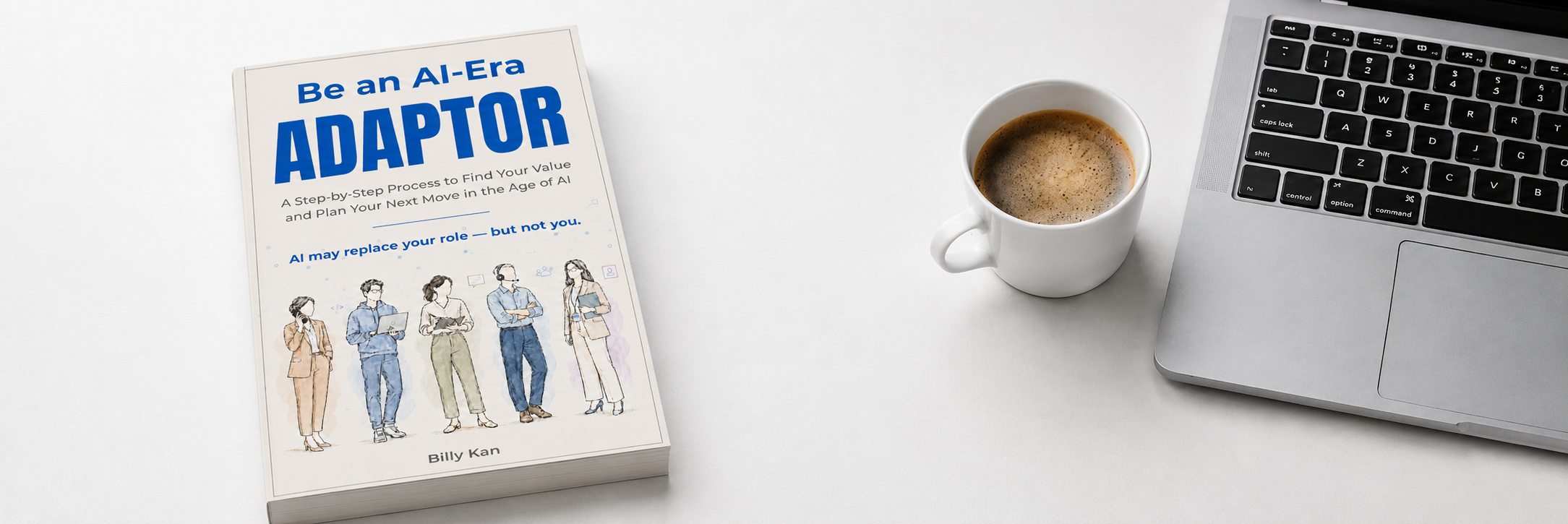 The ADAPTOR book beside a laptop and coffee
